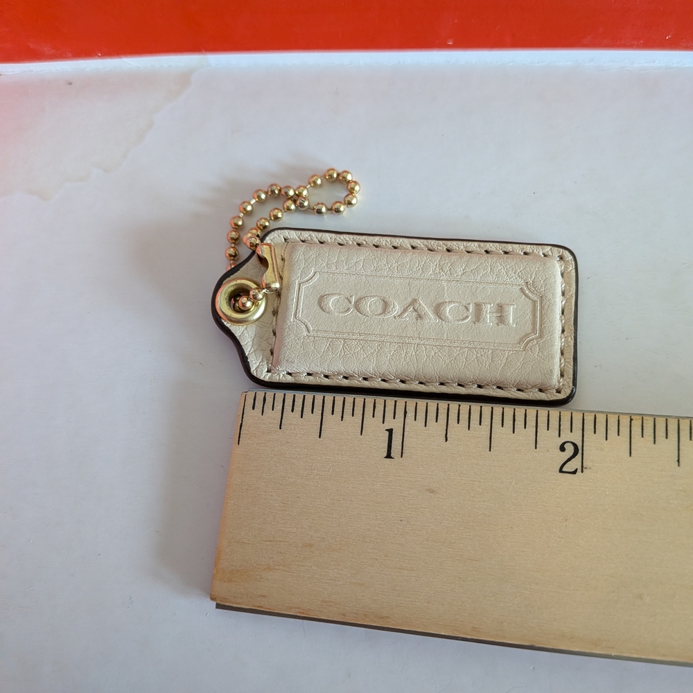 Coach White Pebbled‎  Leather Hang Tag  in Cream with Gold Chain